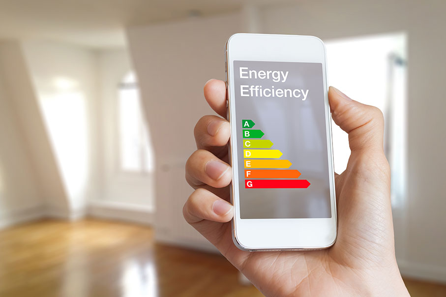 Energy Performance Certificate Chart Displayed On A Mobile Phone With Empty Room In THe Background