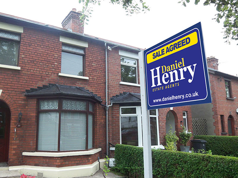 A Daniel Henry Estate Agent Sale Agreed Board Erected Outside A Mid Terrace Property